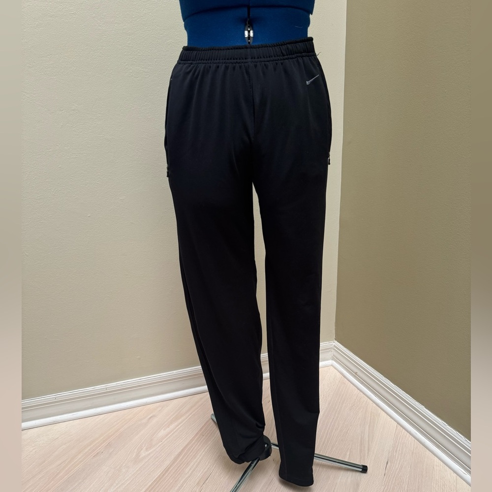 Nike size M Dri-Fit jogging pants.